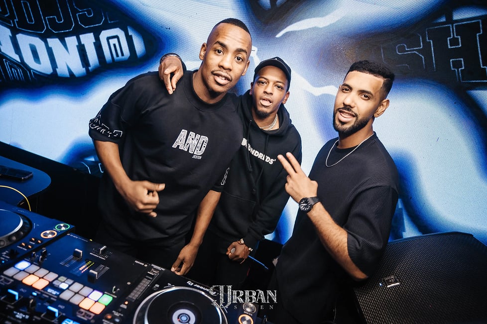DJ booth with three people