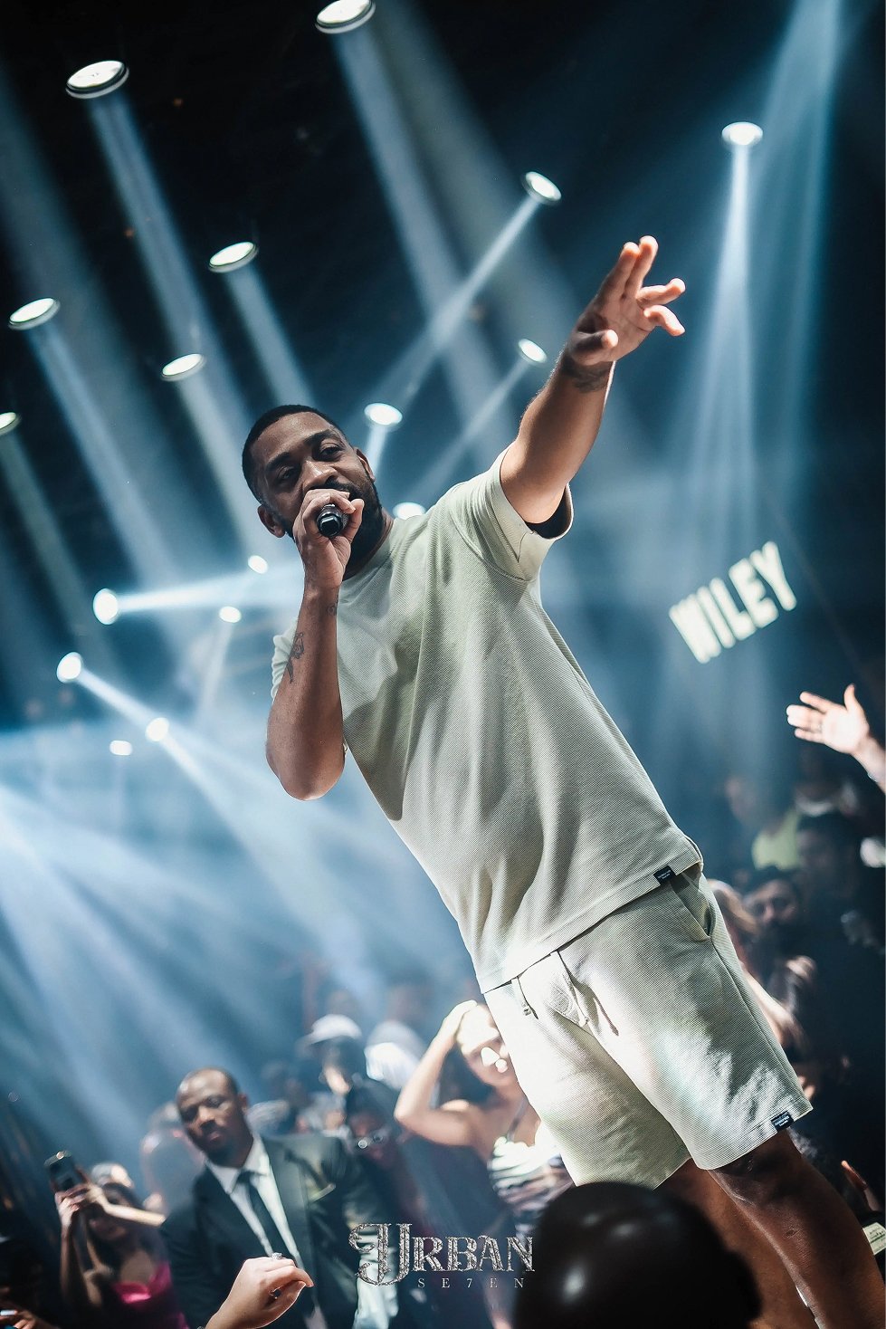 Performer on stage with dramatic lighting