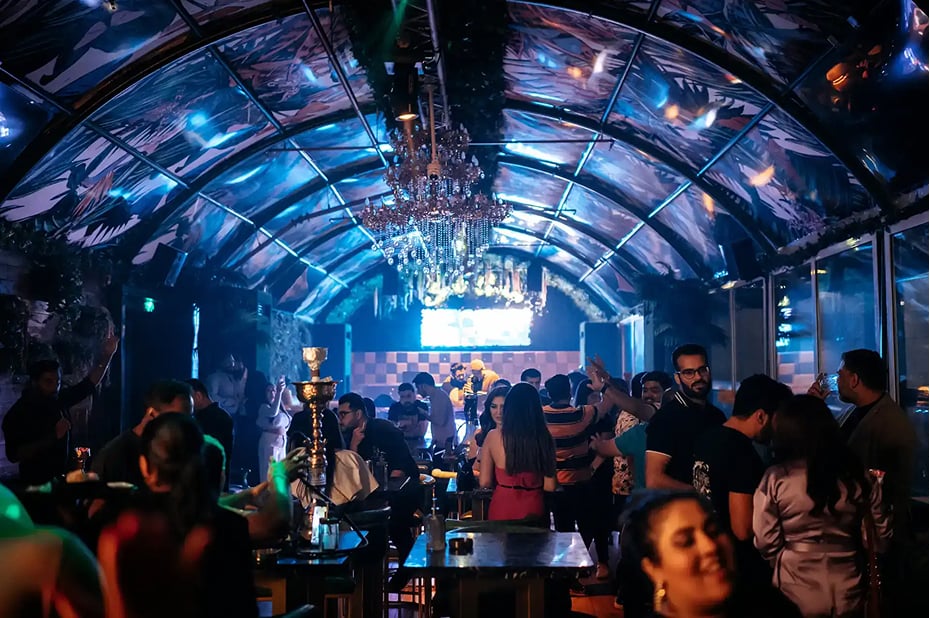 Nightclub crowd with blue lighting